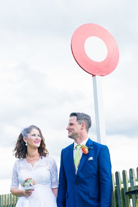 BNewmarket Racecourse Wedding Photographer - Bride and Groom at the winning post