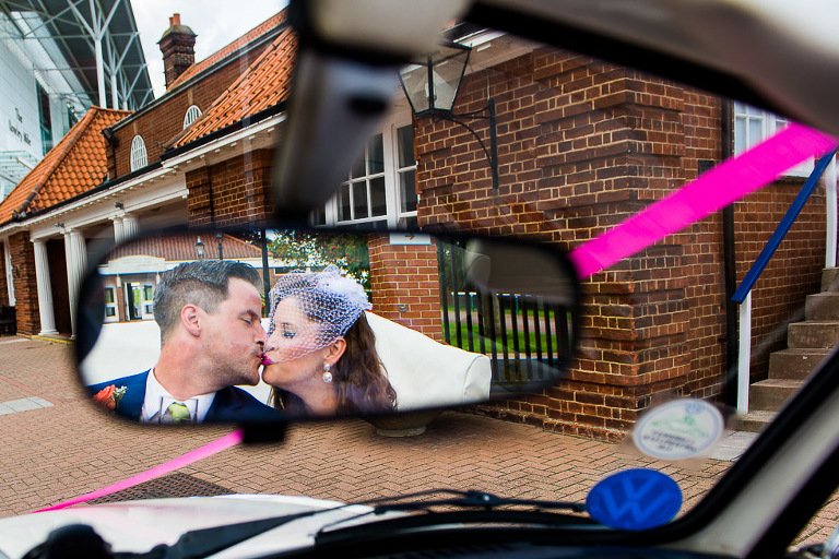 Newmarket Racecourse Wedding Photographer - kiss in rear view mirror