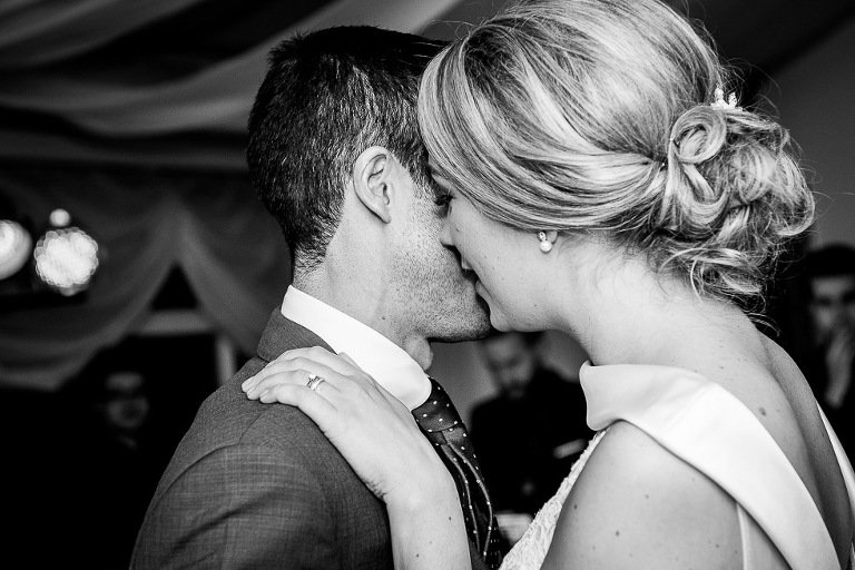 Stanhill Court Wedding Photographer - first dance kiss in black and white