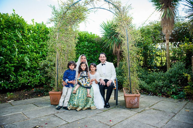 Shot in garden of Enfield Register Office of newlywed bride and groom
