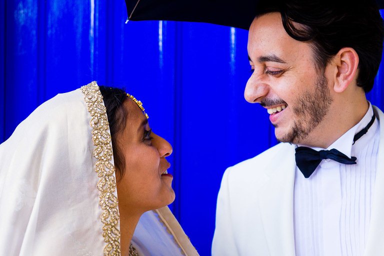 Bride and Groom in front of blue doorway at Enfield Register Office