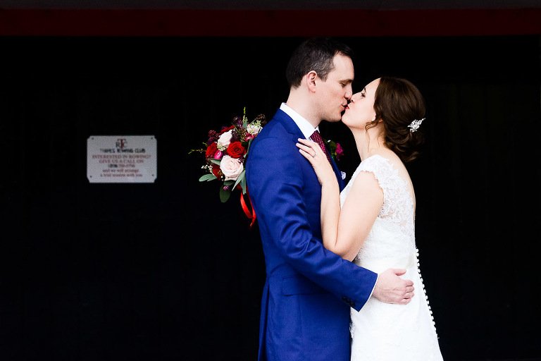 Bride and Groom kiss at Thames Rowing Club