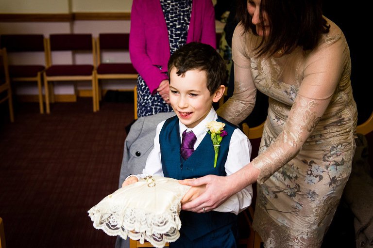 ring bearer with ring on cushion at Ely Register Office