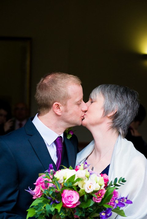 Bride and Groom kiss at Ely Register Office