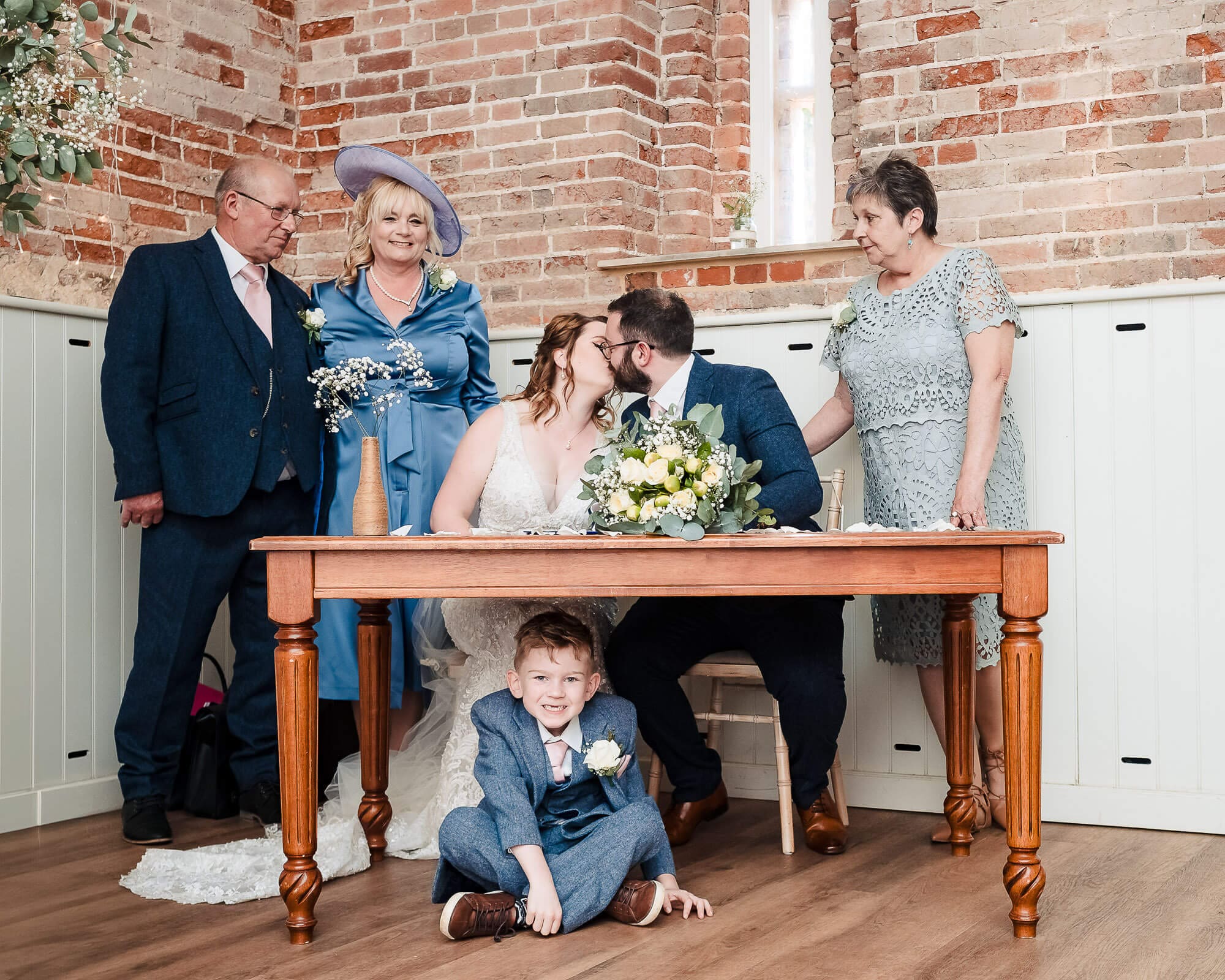 son hijacks new bride and groom at the signing of the register