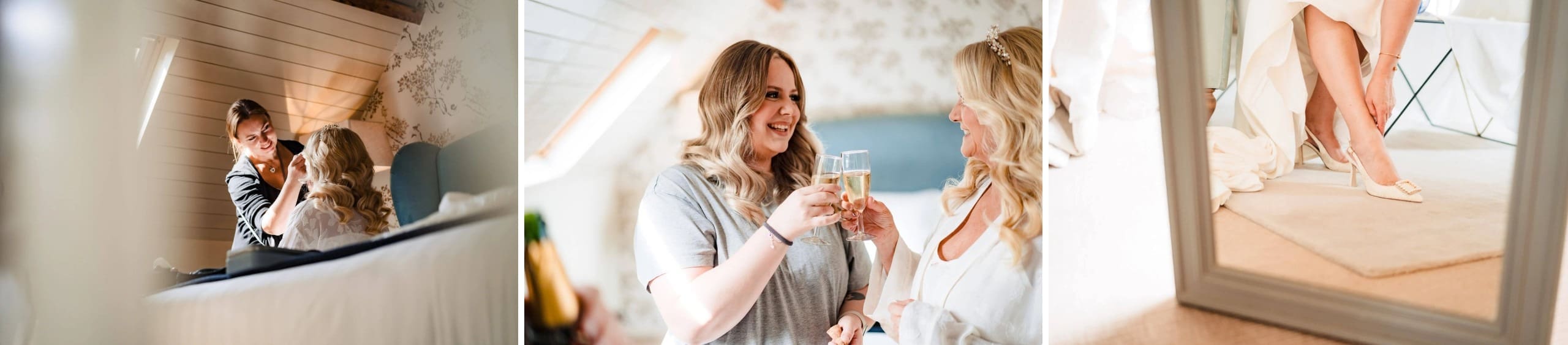 Mother adjusting her daughter's hair and makeup in a bedroom mirror. — Wedding at South Farm, Cambridgeshire
